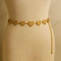 Gold heart chain belt on mannequin, designer jewelry accessory display